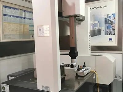 Compression set testing of a strut mount rubber component at 70 degrees Celsius