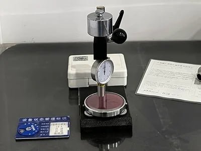 Rubber hardness testing of a strut mount using a Shore A durometer
