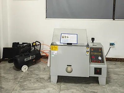 Salt spray corrosion testing of strut mount metal components